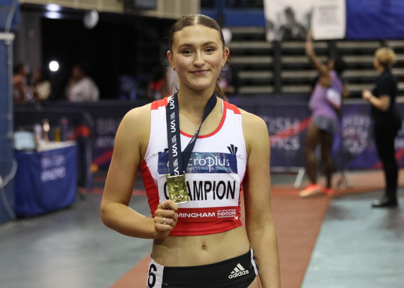 Abi Pawlett shows off her gold medal.